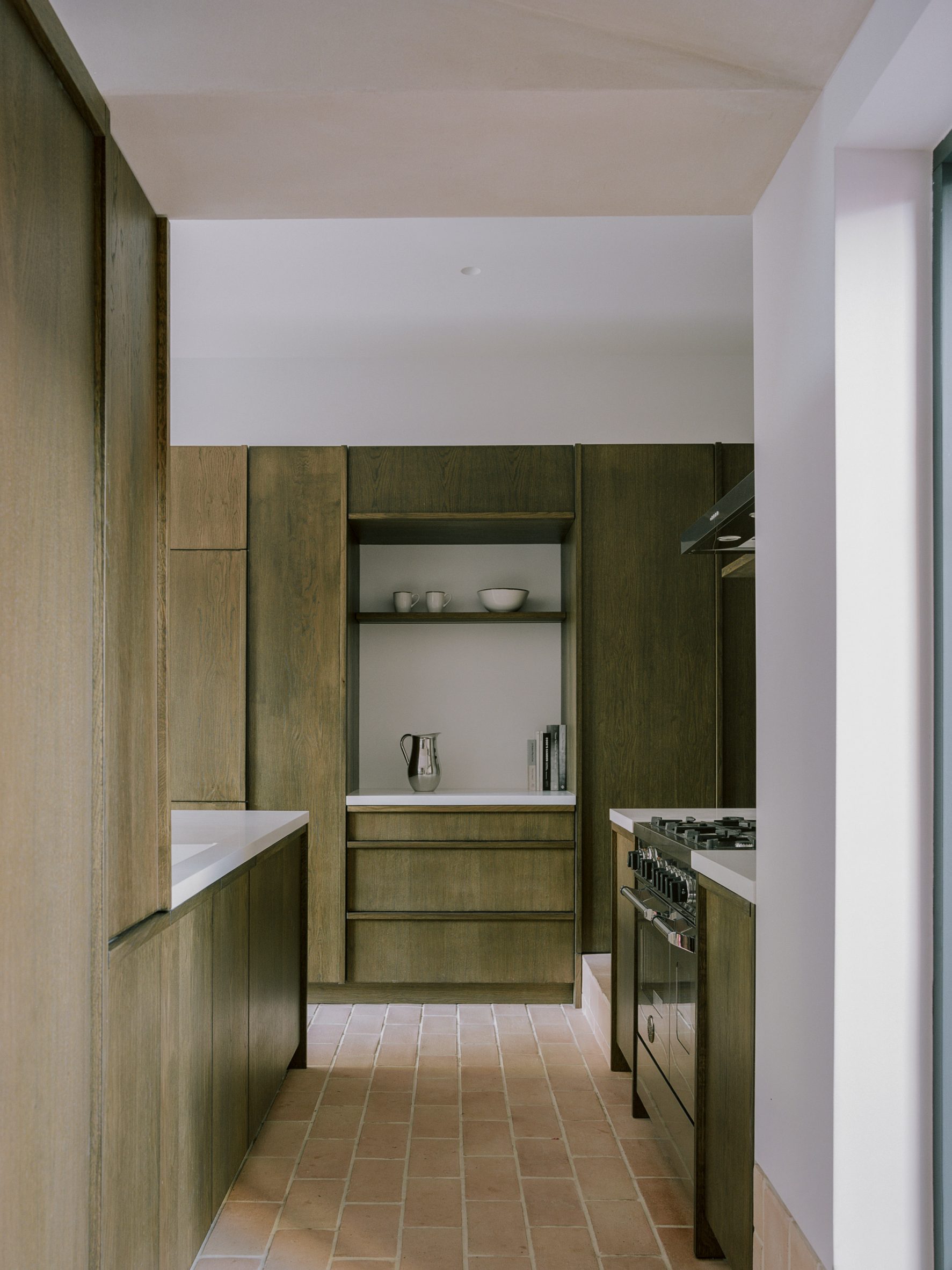 Oak kitchen cabinetry with small nook in Aperture House