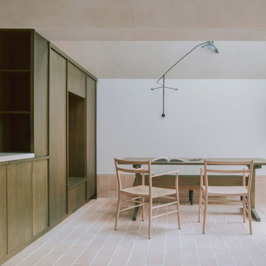 Dining room interior of Aperture House by Studio McW with wooden cabinet, table and chairs