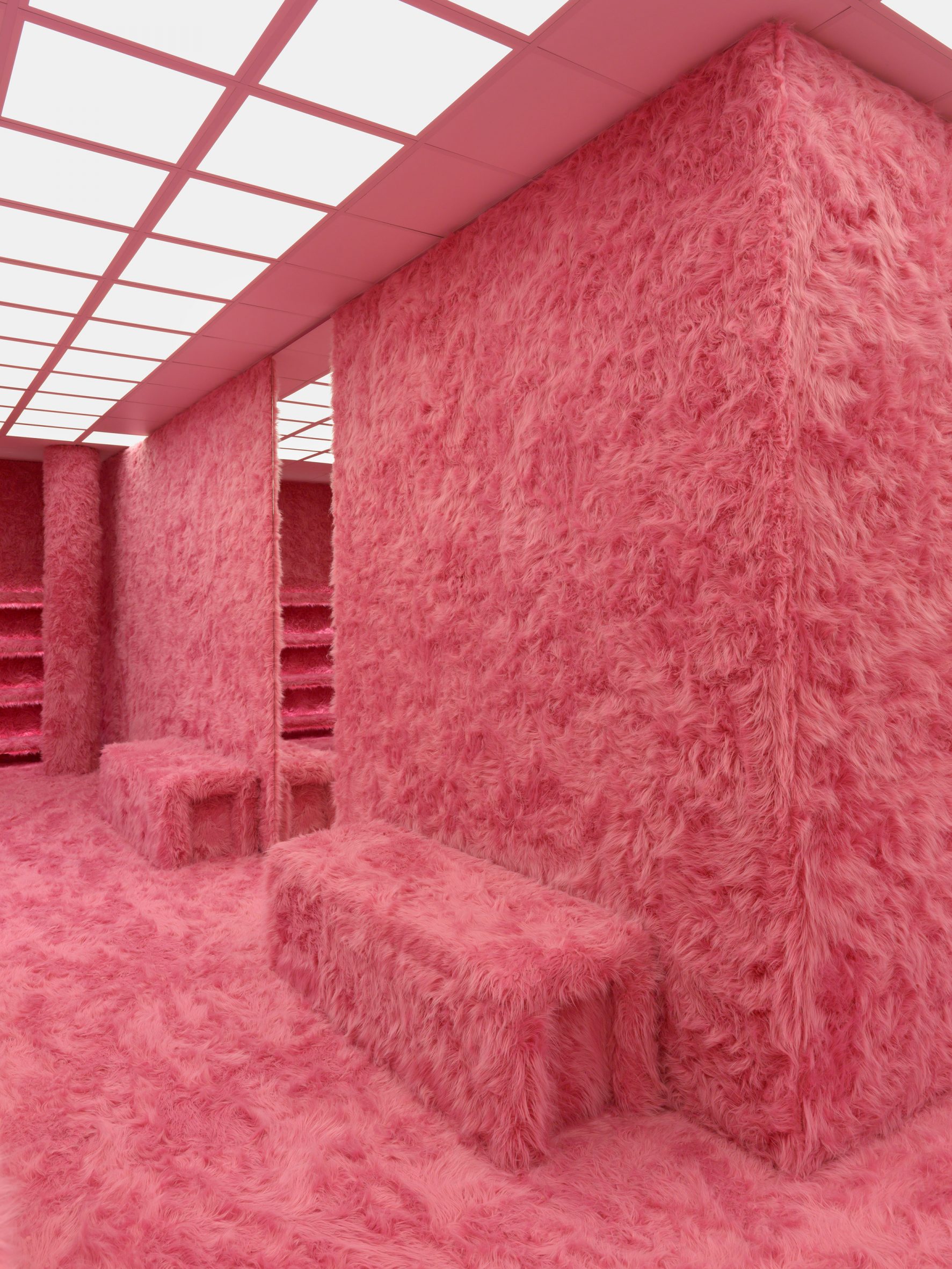 Pink faux fur covers the walls and floor of the Le Cagole pop-up