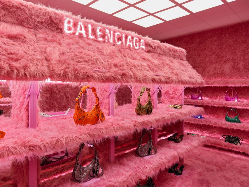 Lit up Balenciaga logo is pictured in fur shelving