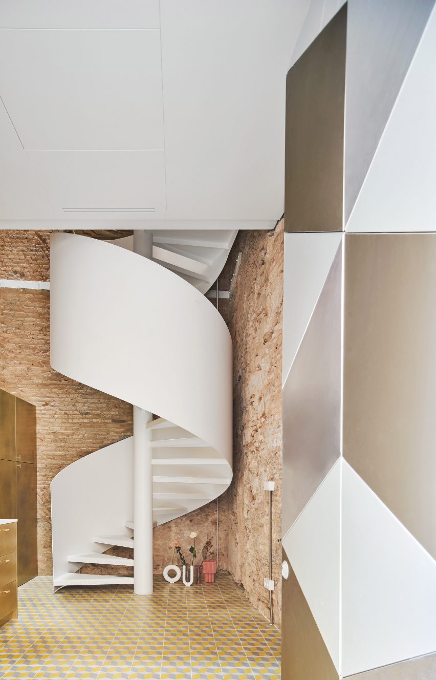 Spiral staircase features inside BSP20 House by Raúl Sánchez Architects