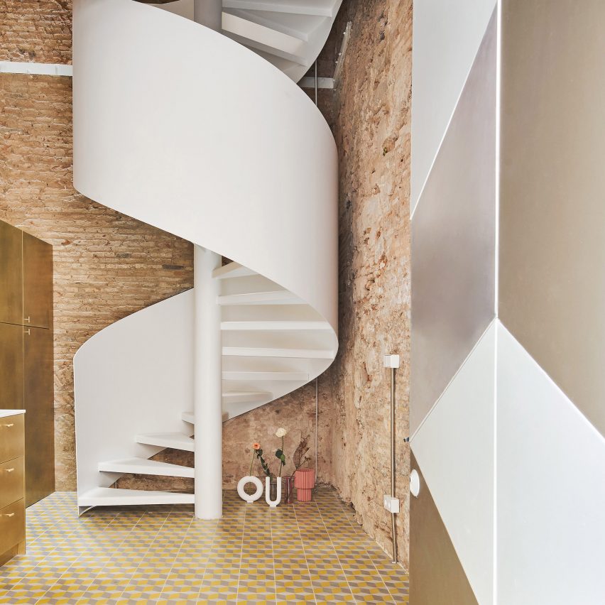 Spiral staircase features inside BSP20 House by Raúl Sánchez Architects