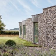 Hudson Architects wraps Coast House in flint and Corten walls