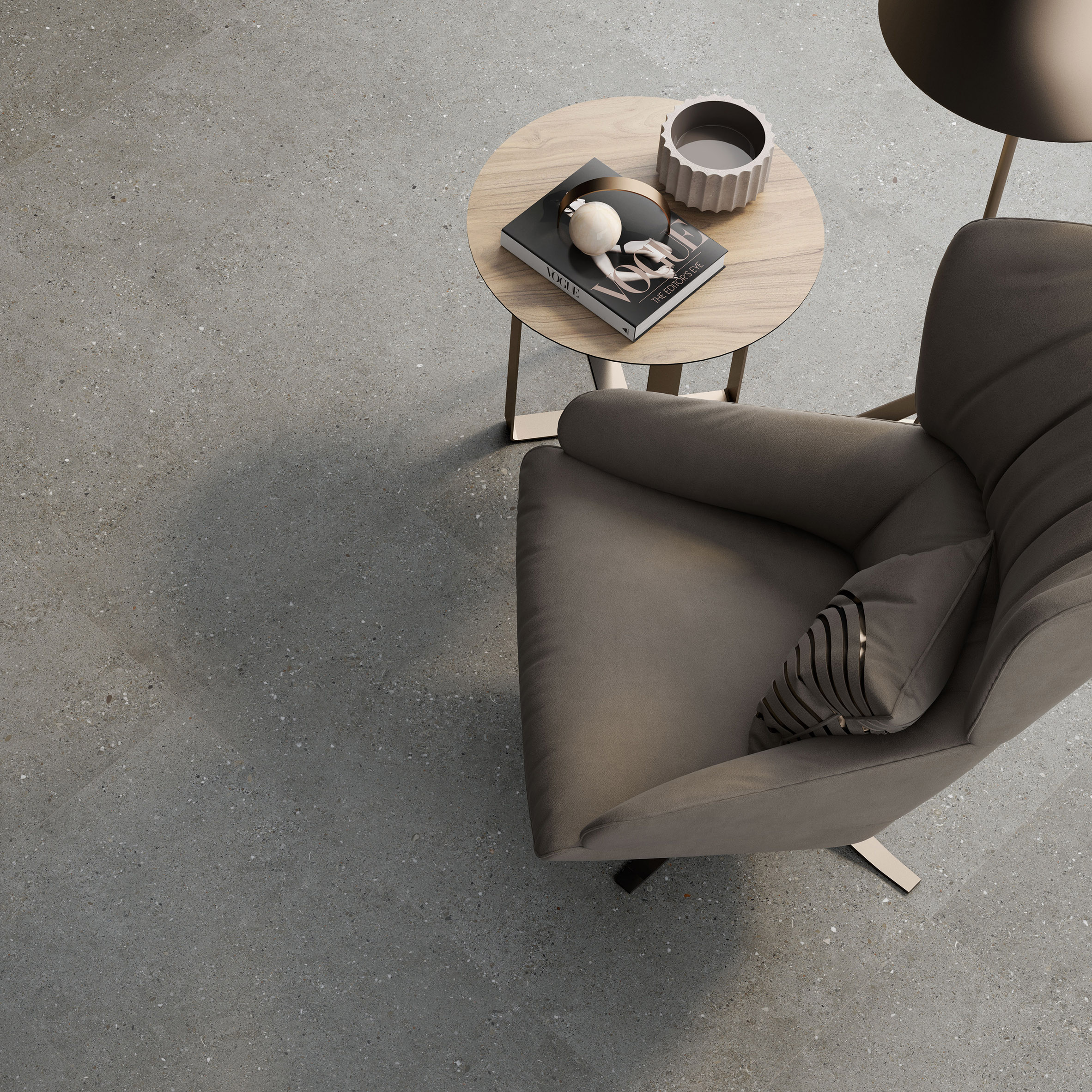 Grey Doge tiles pictured from above with brown armchair and side table