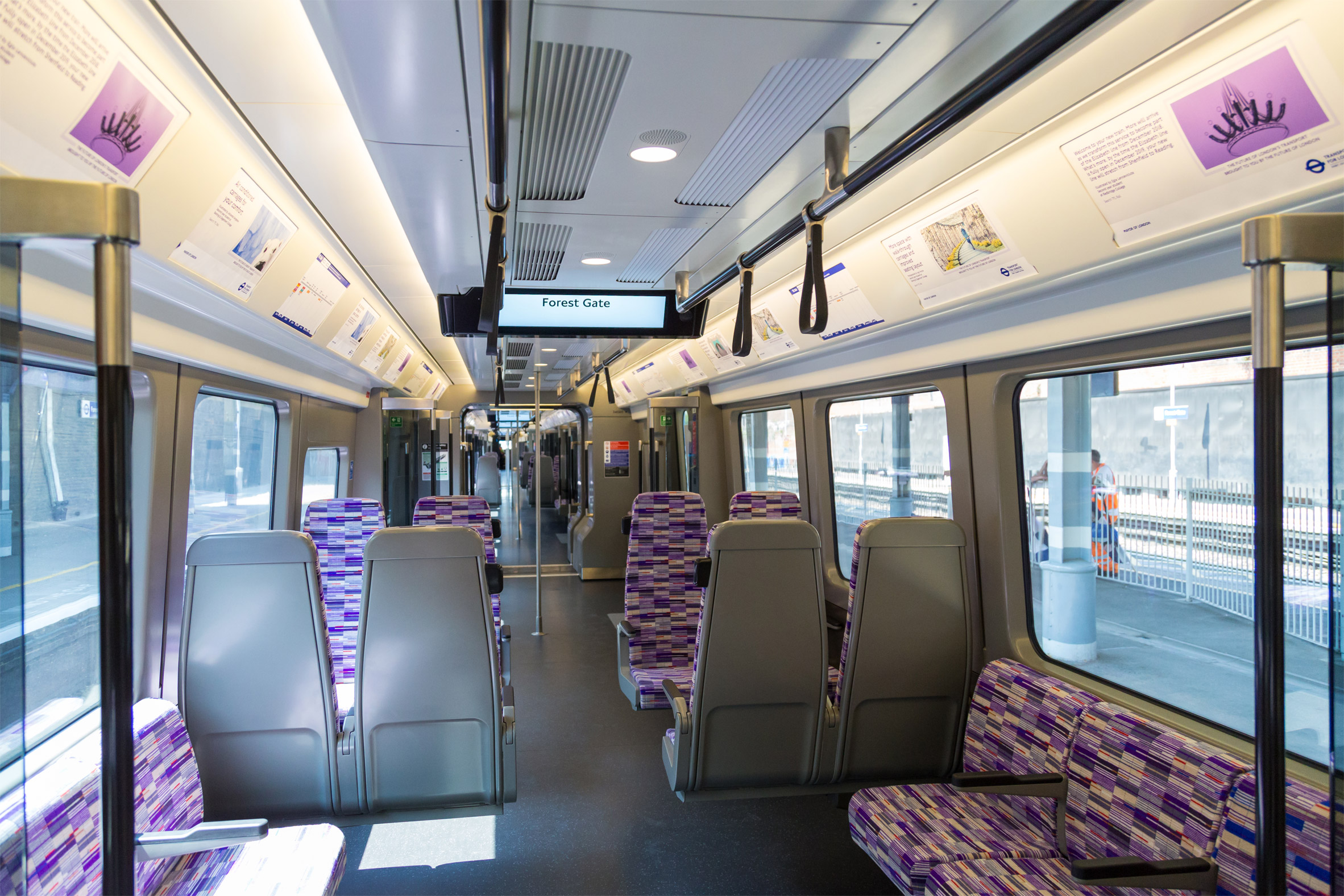 An Elizabeth line train with seats by Wallace Sewell