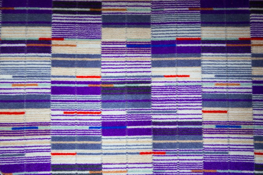 A purple pinstripe fabric pattern