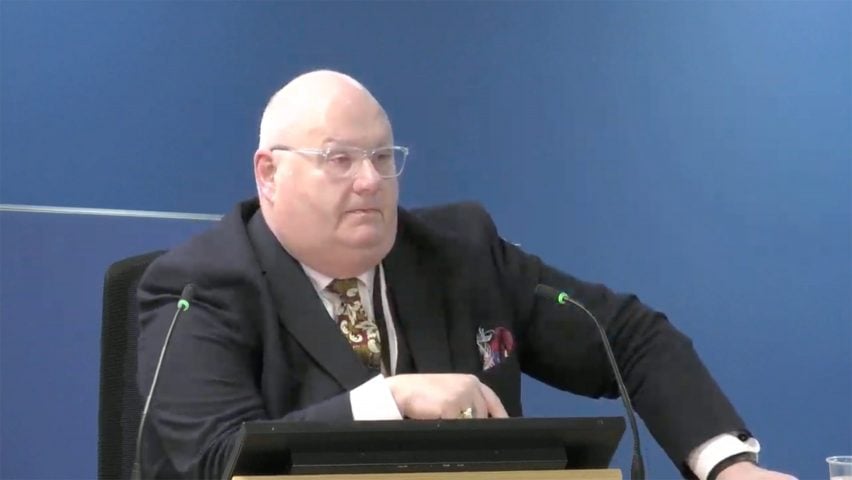 Eric Pickles with hand on Bible