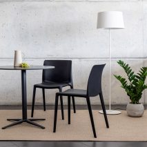 black fluit chairs by actiu around a table