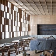 Gridded timber panels and granite counter in Hiba restaurant in Tel Aviv by Pitsou Kedem