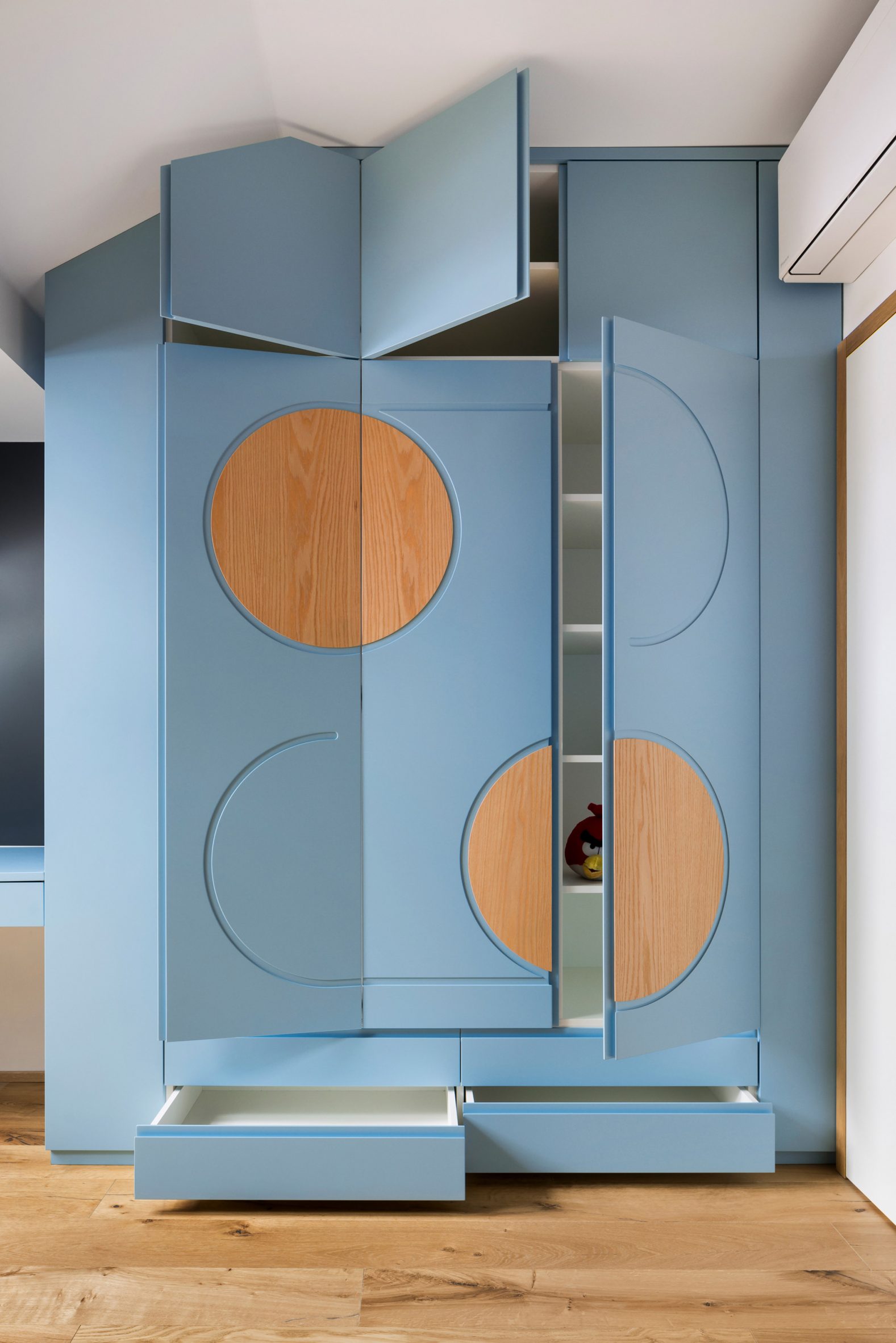 Baby blue built-in cupboards with large, rotated '69' motif