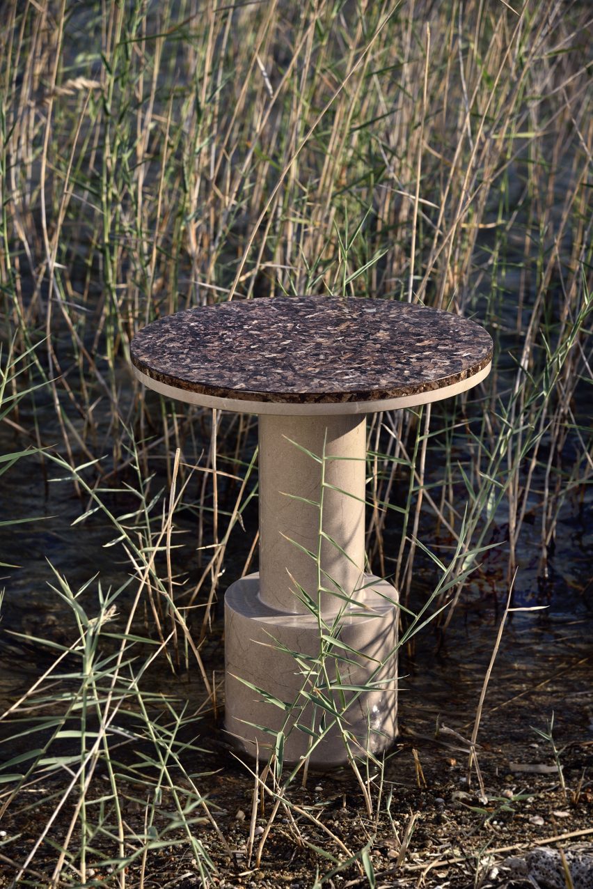 Round Oceanides table with base in a grassy wetland