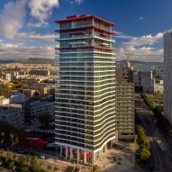 Red balconies top Odile Decq's Antares tower in Barcelona