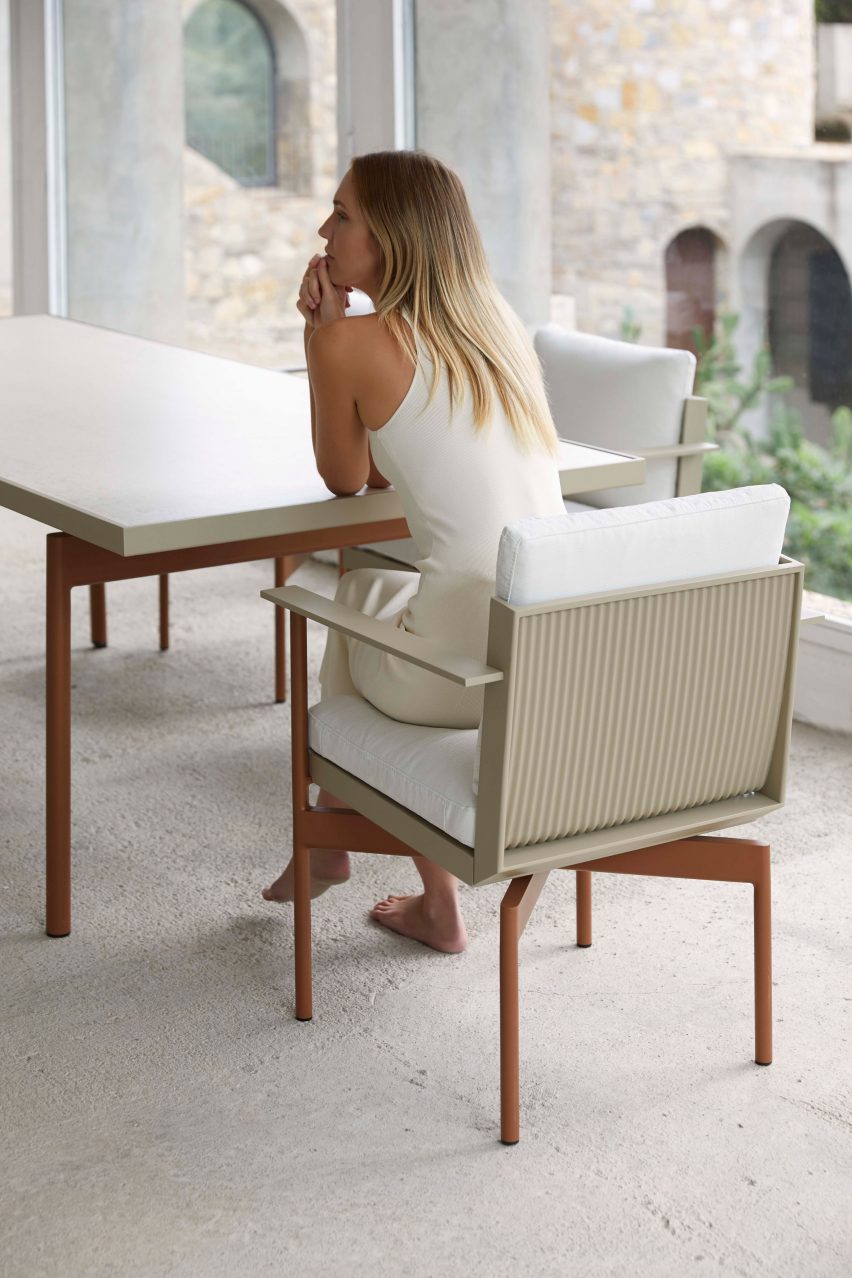 Woman sitting indining chair by Luca Nichetto for Gandia Blasco