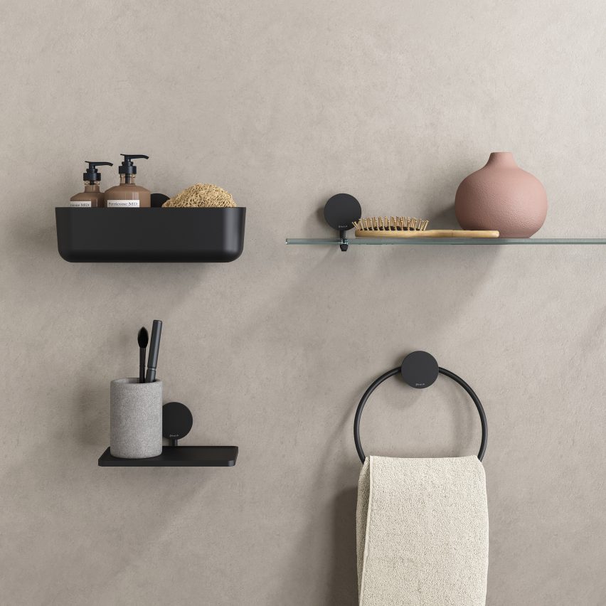 Opal towel ring on a concrete wall with other wall-mounted bathroom accessories