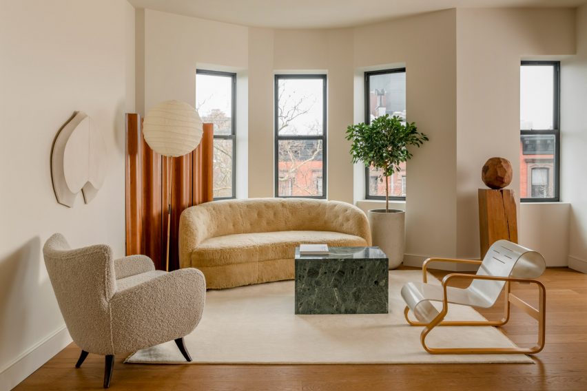 A living room inside Amity Street Residence with warm neutral colour palette