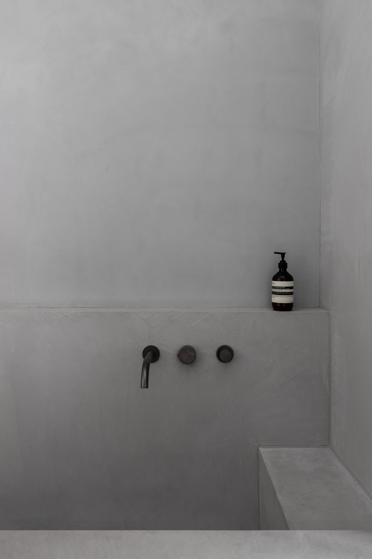 Concrete tub in bathroom interior of Ripponlea House 