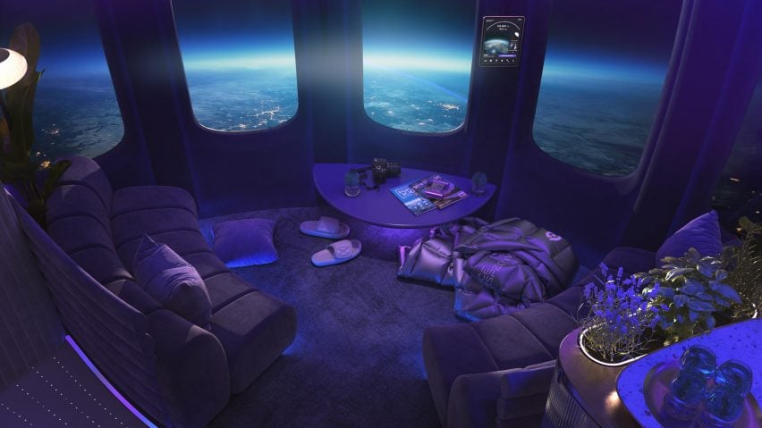 Neptune Space Lounge configured with sofas, blankets and slippers facing out towards a view of the Earth