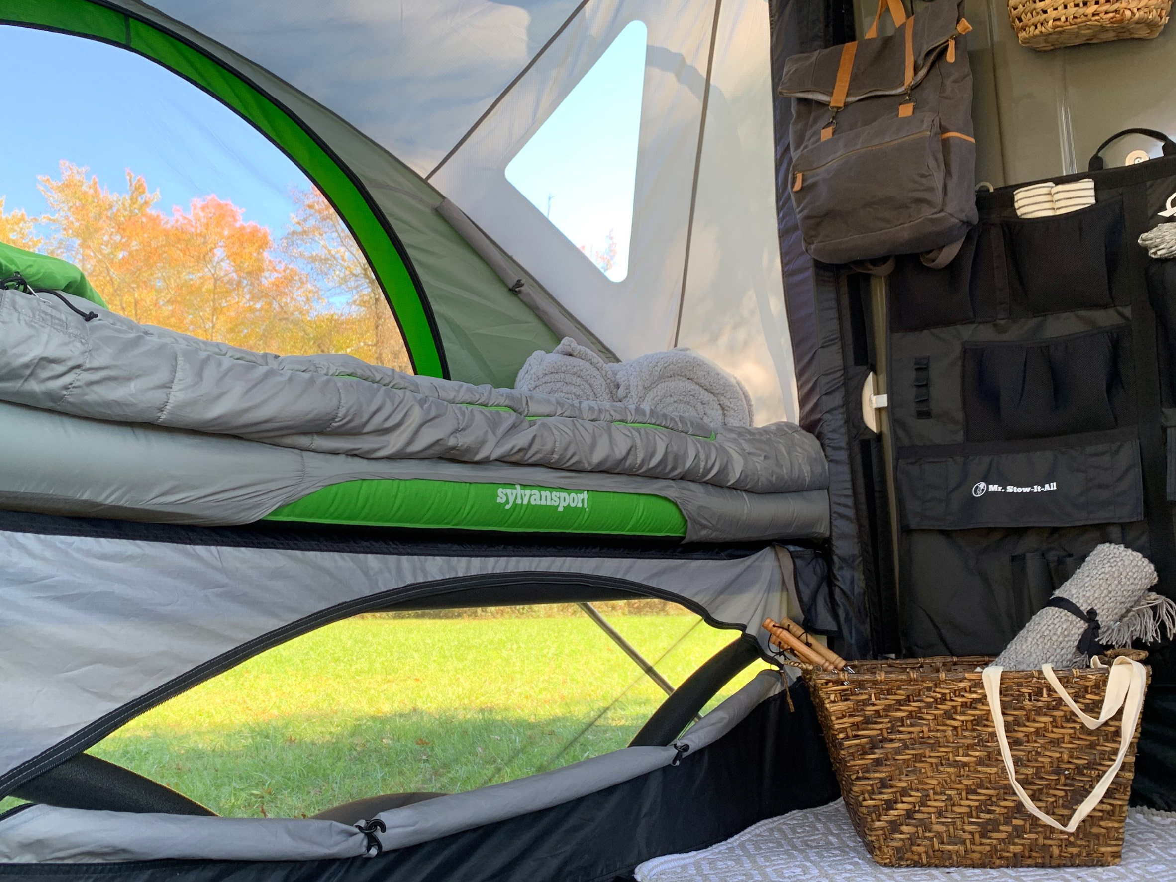 Various accessories hang from the wall of the SylvanSport Go pop-out tent