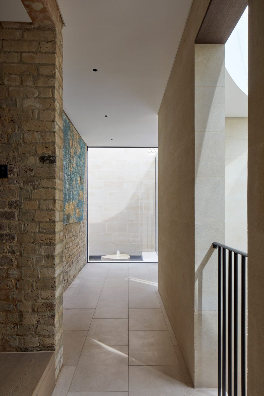 Hallway with exposed brick walls