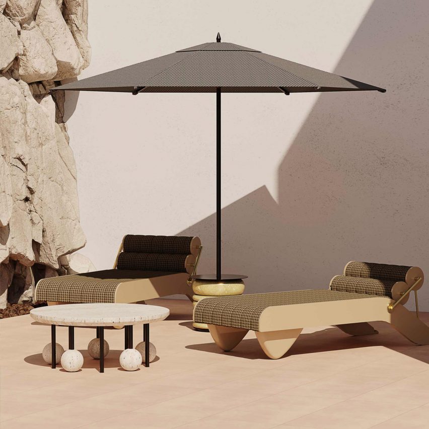 Two Tropez Daybed by Hommés Studio in fern fabric ourdoors under a sun umbrella