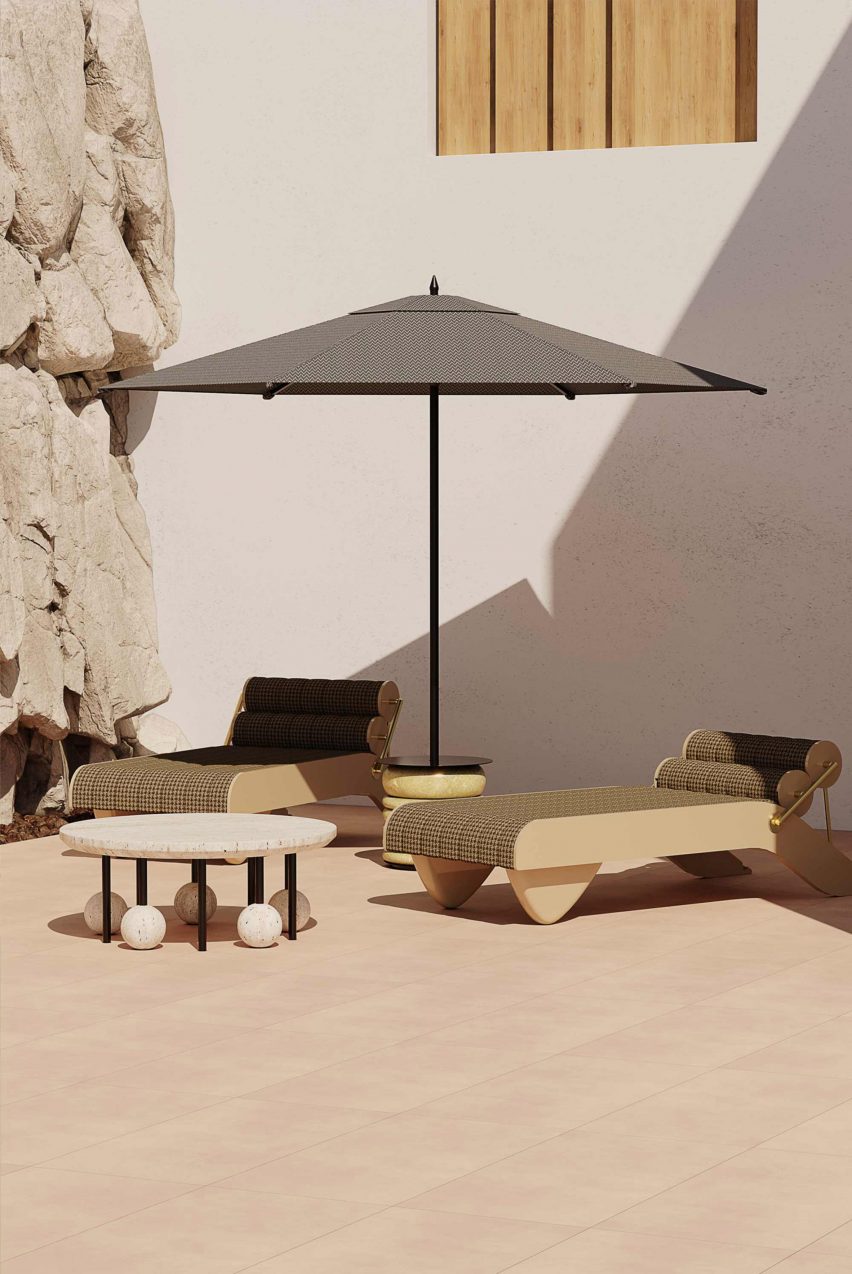 Two Tropez Daybed by Hommés Studio in fern fabric ourdoors under a sun umbrella