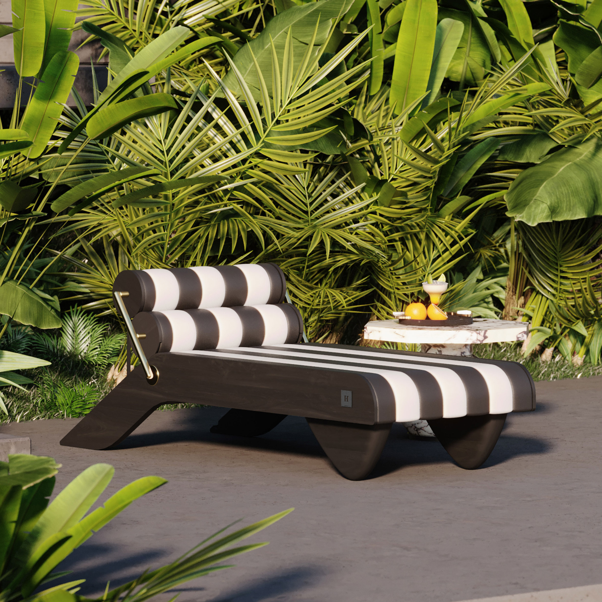 Black and white striped Tropez Daybed outdoors amongst greenery
