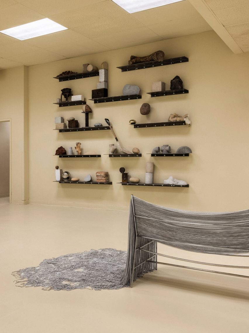 wall sculpture and metal bench