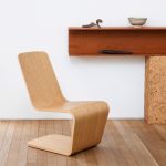 A photograph of a wooden chair by Isokon Plus
