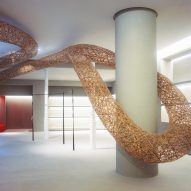 Twisting bamboo installation weaves through Barcelona's Casa Loewe