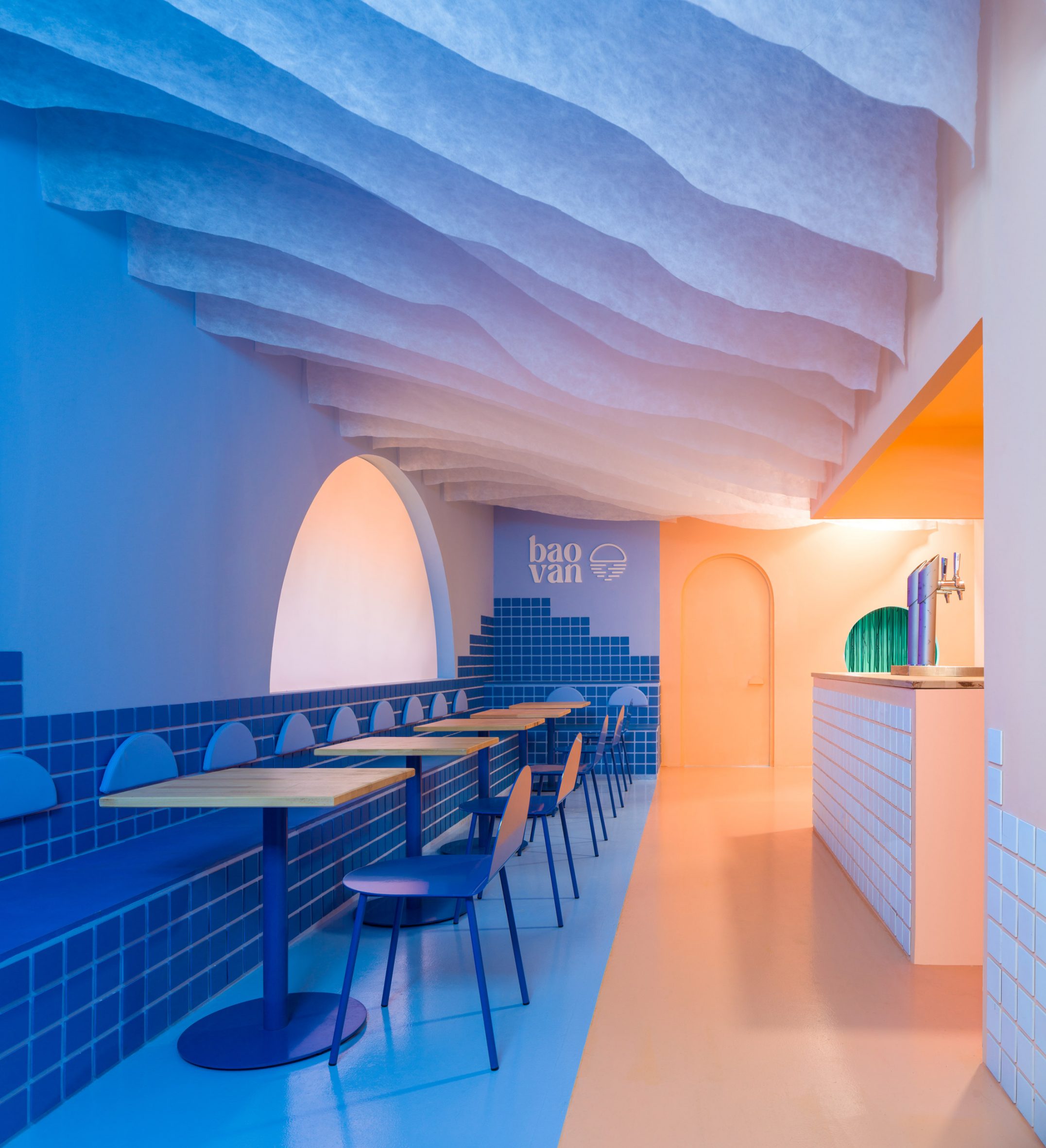 Colour-block blue and peach interior of Baovan restaurant