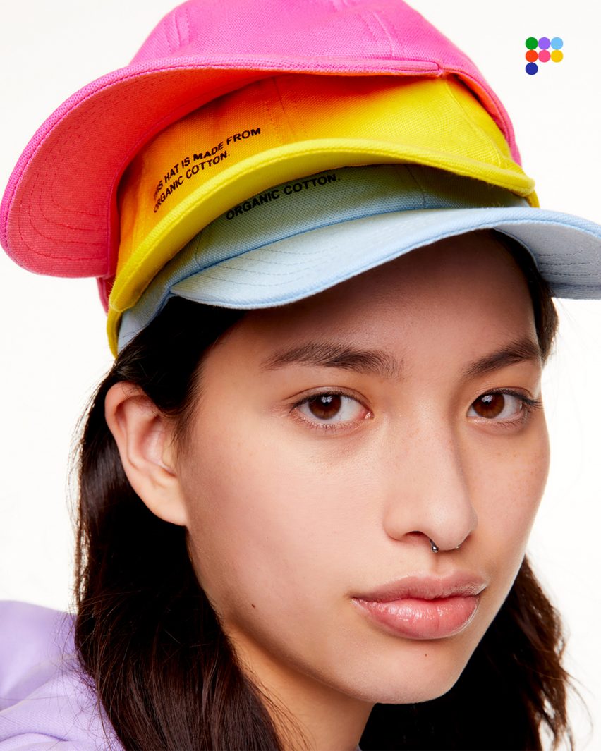 Woman wearing three colourful Pangaia hats