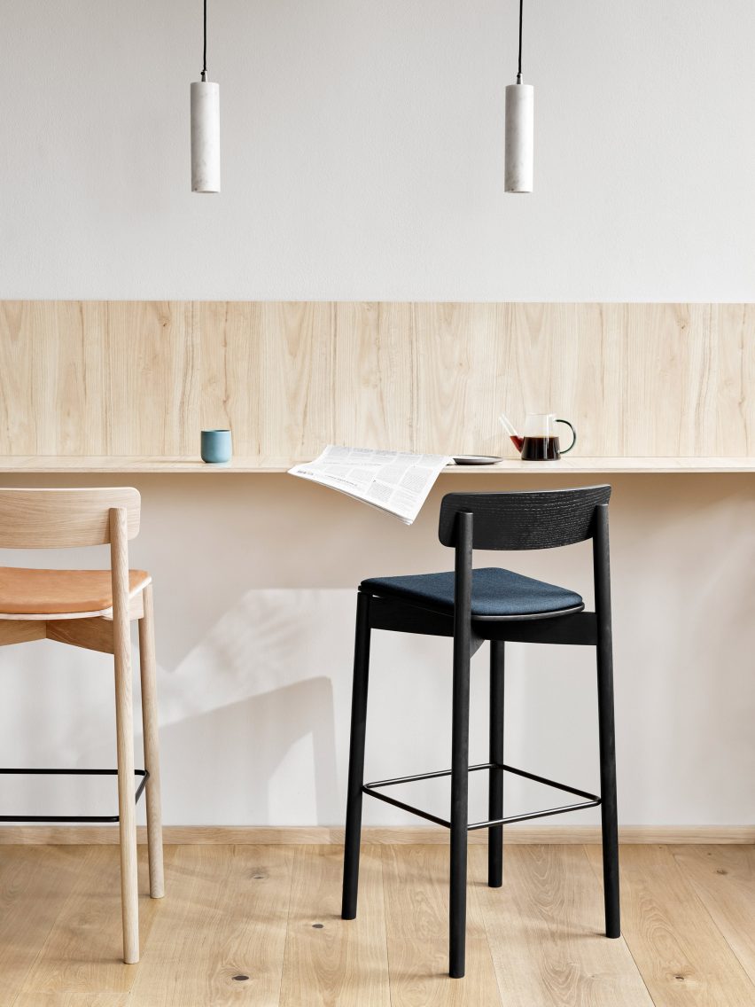 Black and natural wood Cross Bar chairs by Takt at a high table