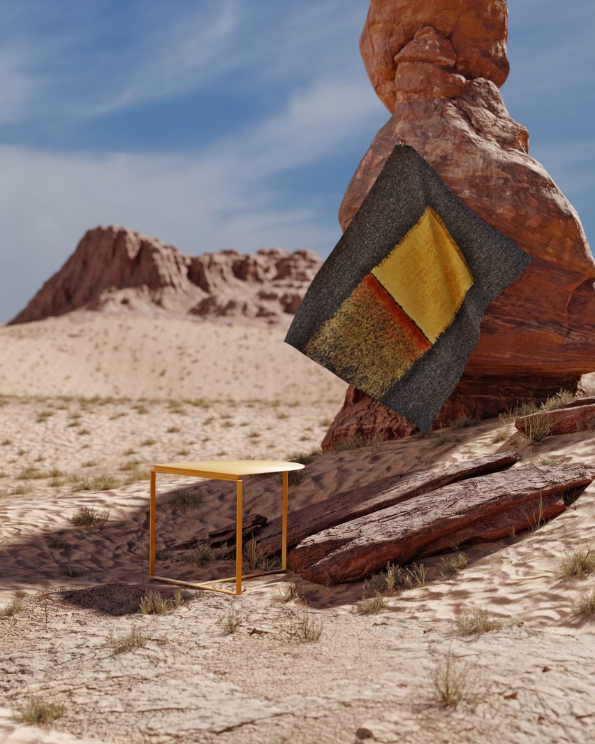 Yellow metal coffee table and textile wall-hanging from the Departures collection photographed in the Wadi Rum desert