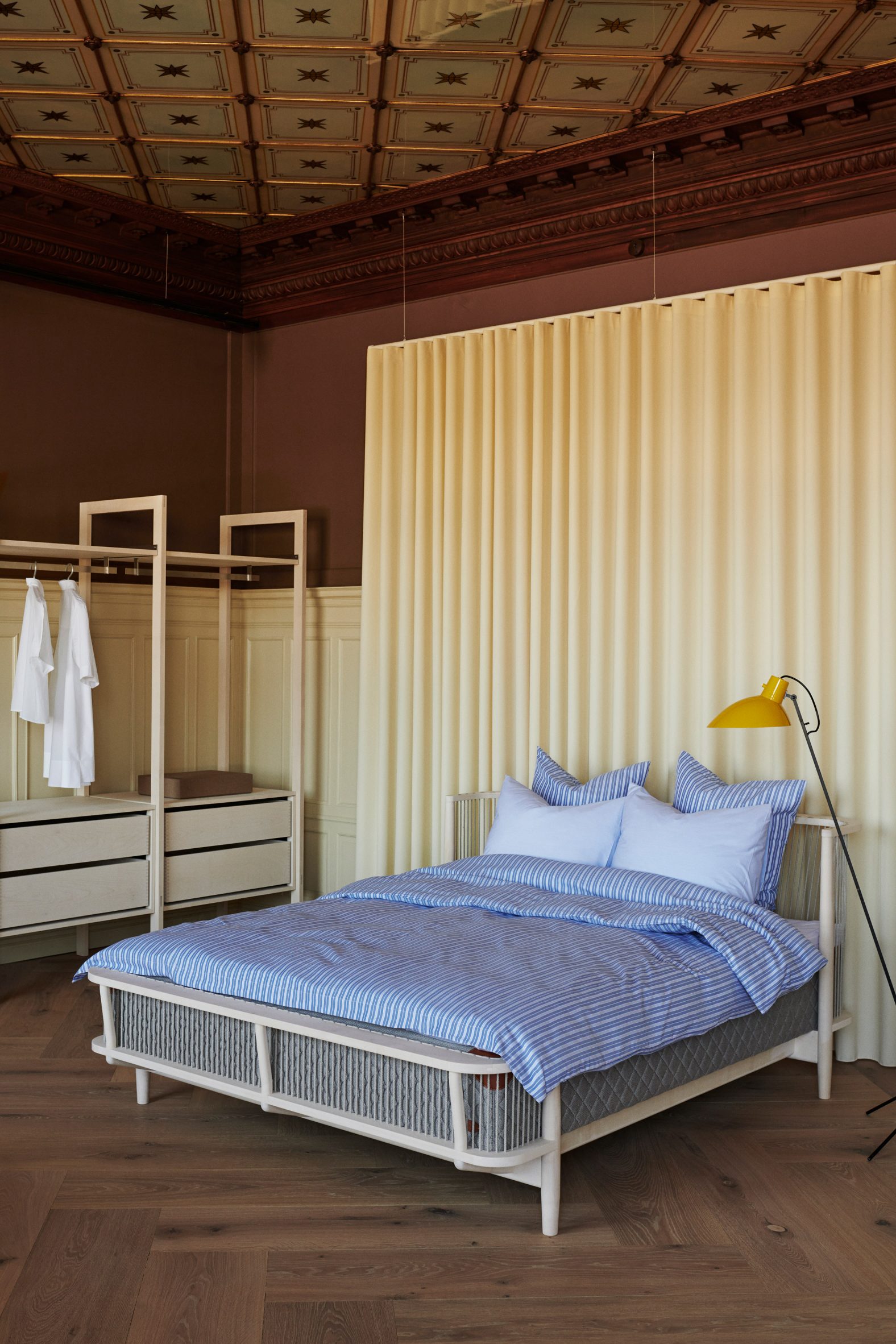 Wooden bed and clothing storage in Garde Hvalsøe showroom