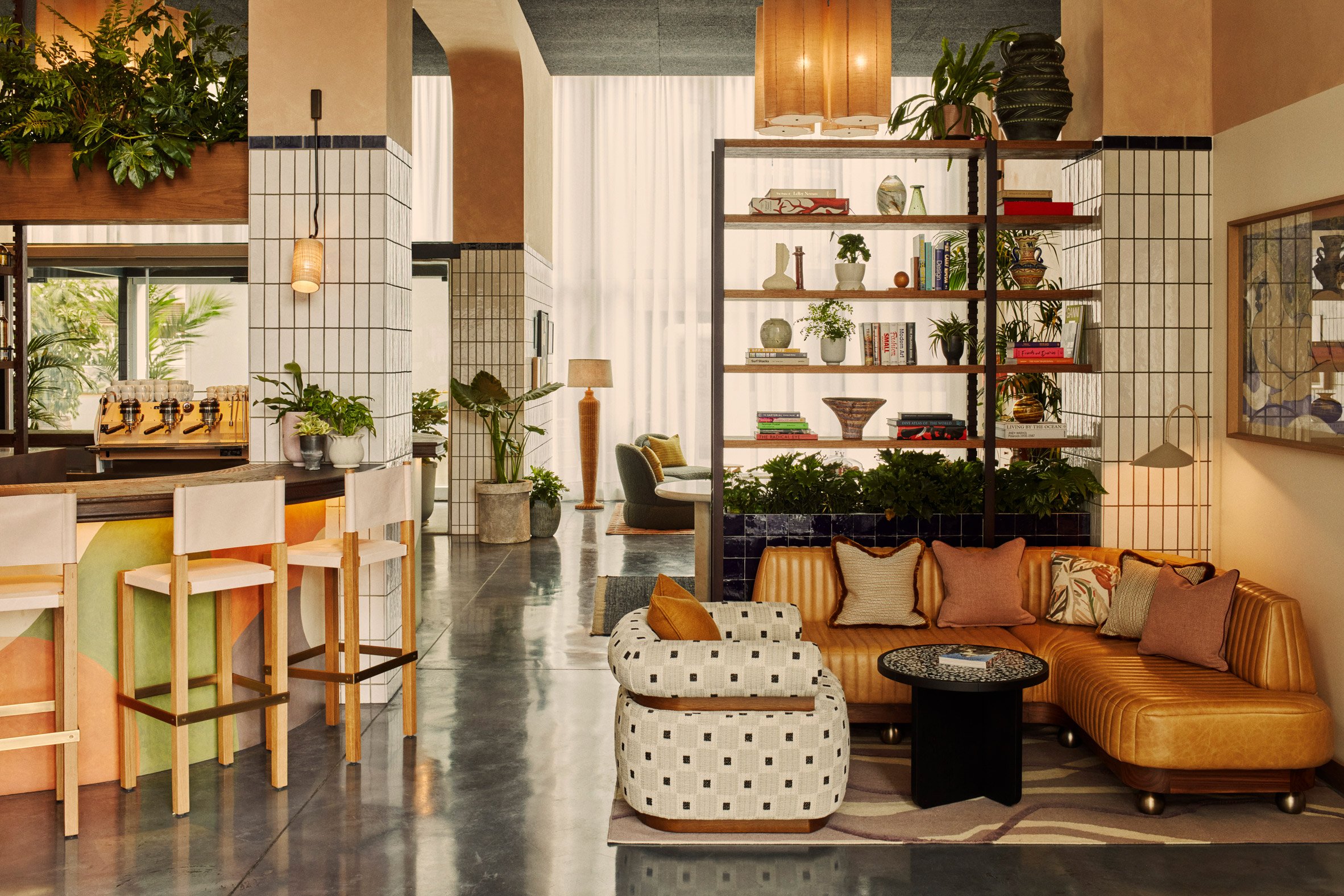 The Hoxton Poblenou's lobby with sofas and a bar
