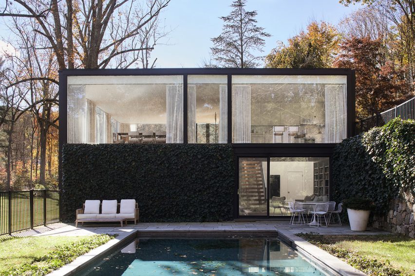 Black modernist house floor to ceiling windows and pool
