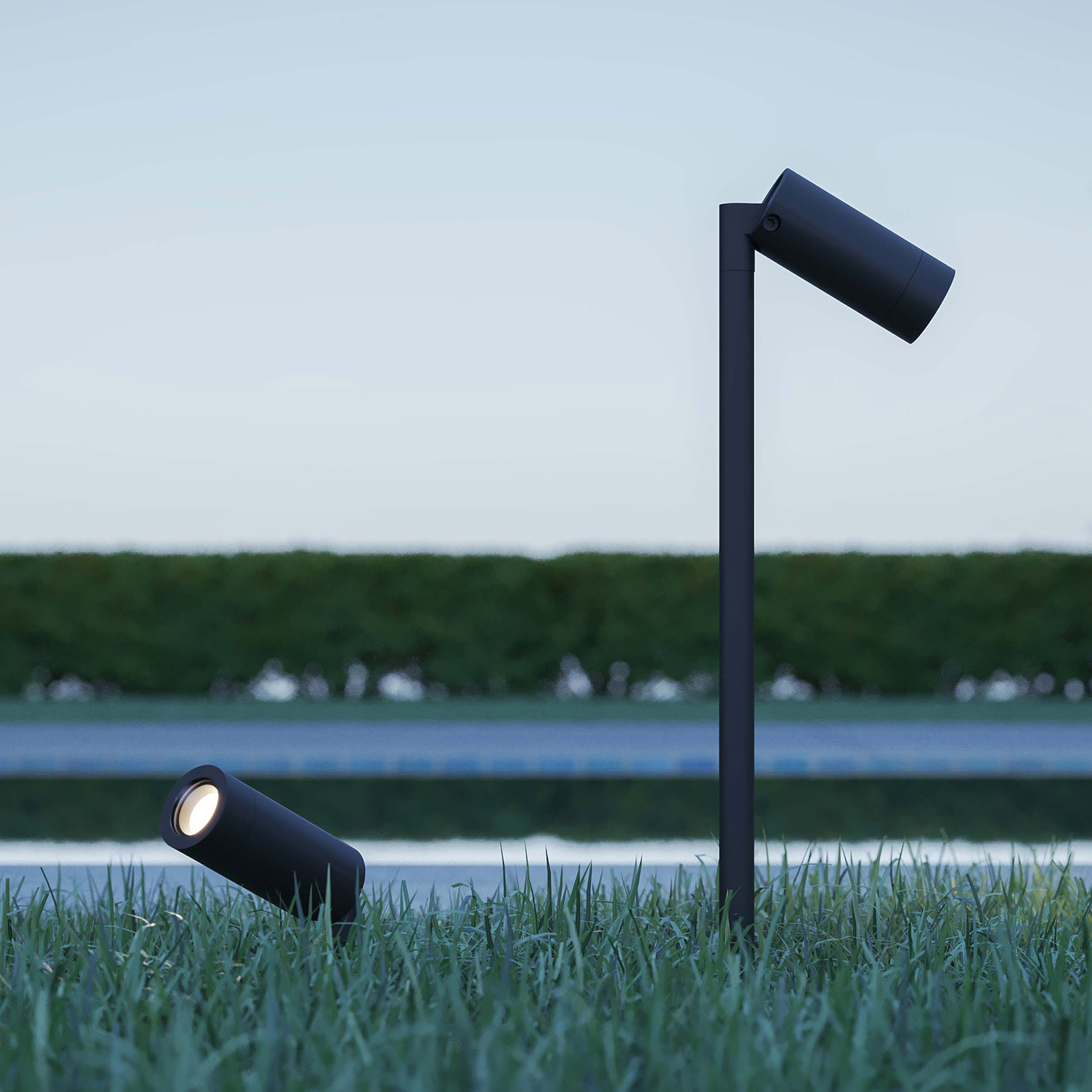 Two Yori IP66 outdoor lighting by Reggiani in the grass