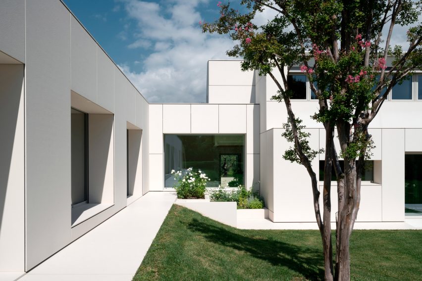 Exterior image of a modern home with full-height windows