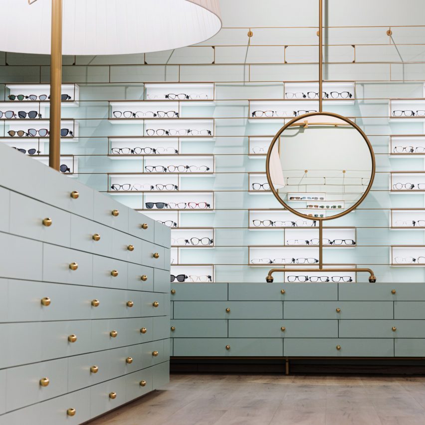 Powder-blue drawers displaying glasses in Morela eyewear store in Ljubljana, Slovenia, designed by Nika Zupanc