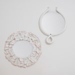 COINCIDENCE by NIVA porcelain-framed mirrors in a ruffle and sausage shape