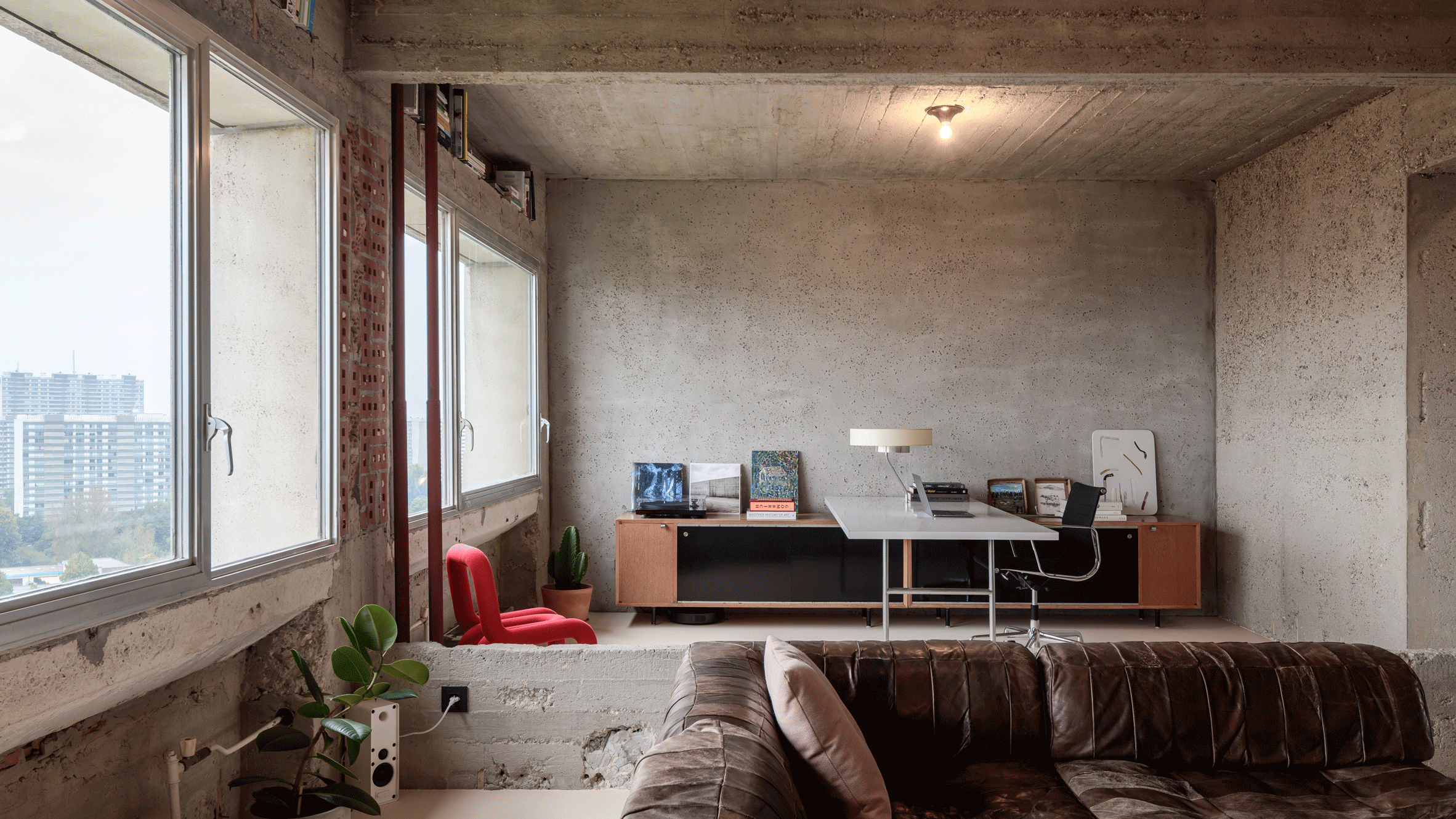 A Brutalist open plan study and living room