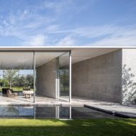 Glass walls and reflecting pool surround private spa at Israeli house