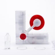 Polyformer recycling machine by Reiten Cheng next to a plastic bottle