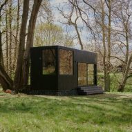 Sigurd Larsen creates compact timber-clad cabin with panoramic windows