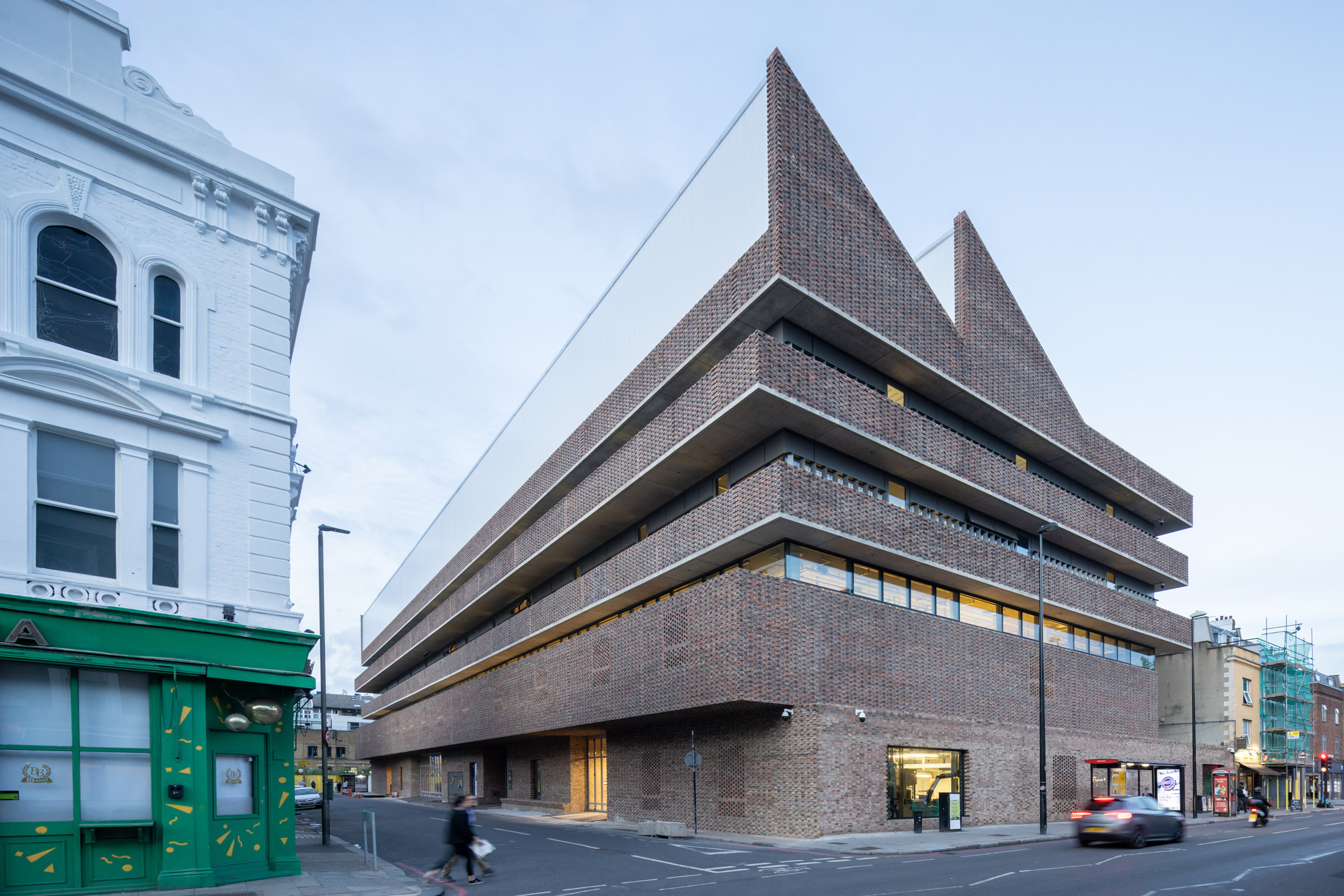 Brick building with sawtooth roof by Herzog & de Meuron