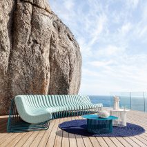 Songololo sofa in an aqua blue colour on a wooden deck