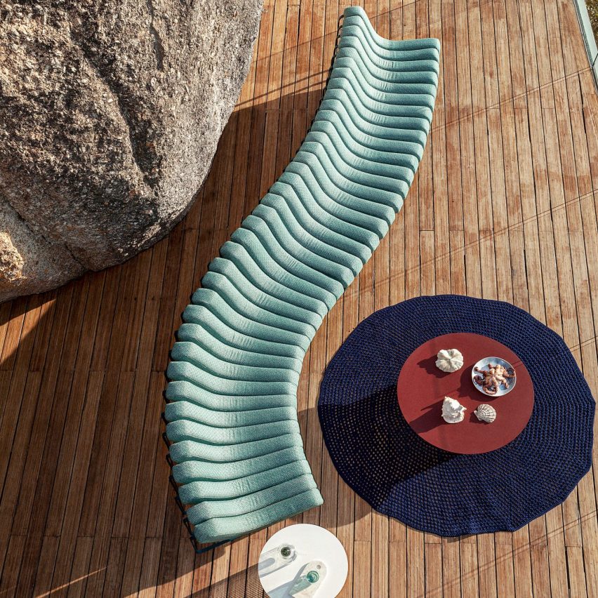 Songololo sofa in aqua blue photographed from above on a wooden deck
