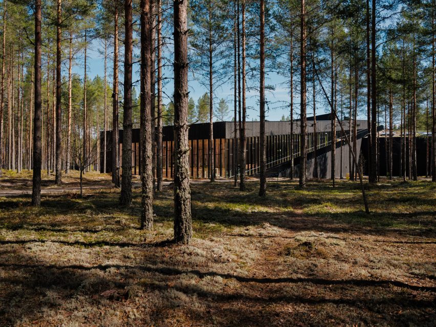 Black wooden Vestre factory in a forest