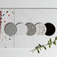 Round and rectangular swatches of terrazzo and marble material laid flat on table