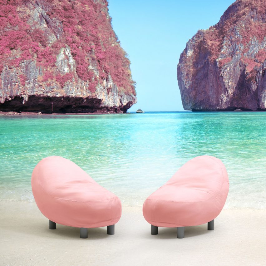 Pink seat with black legs on beach